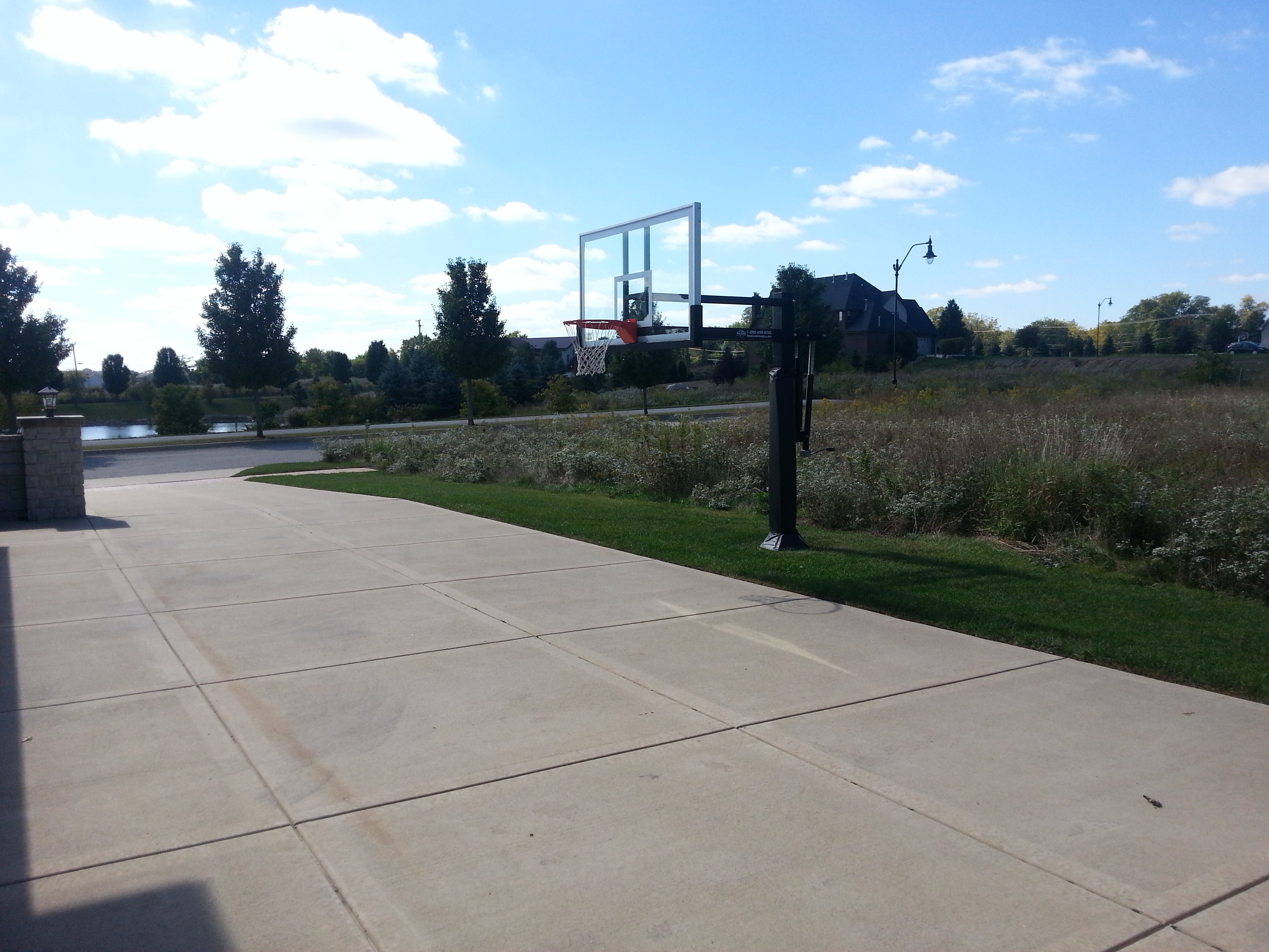 Blue skies hang brightly over this Pro Dunk Silver Basketball system installation.