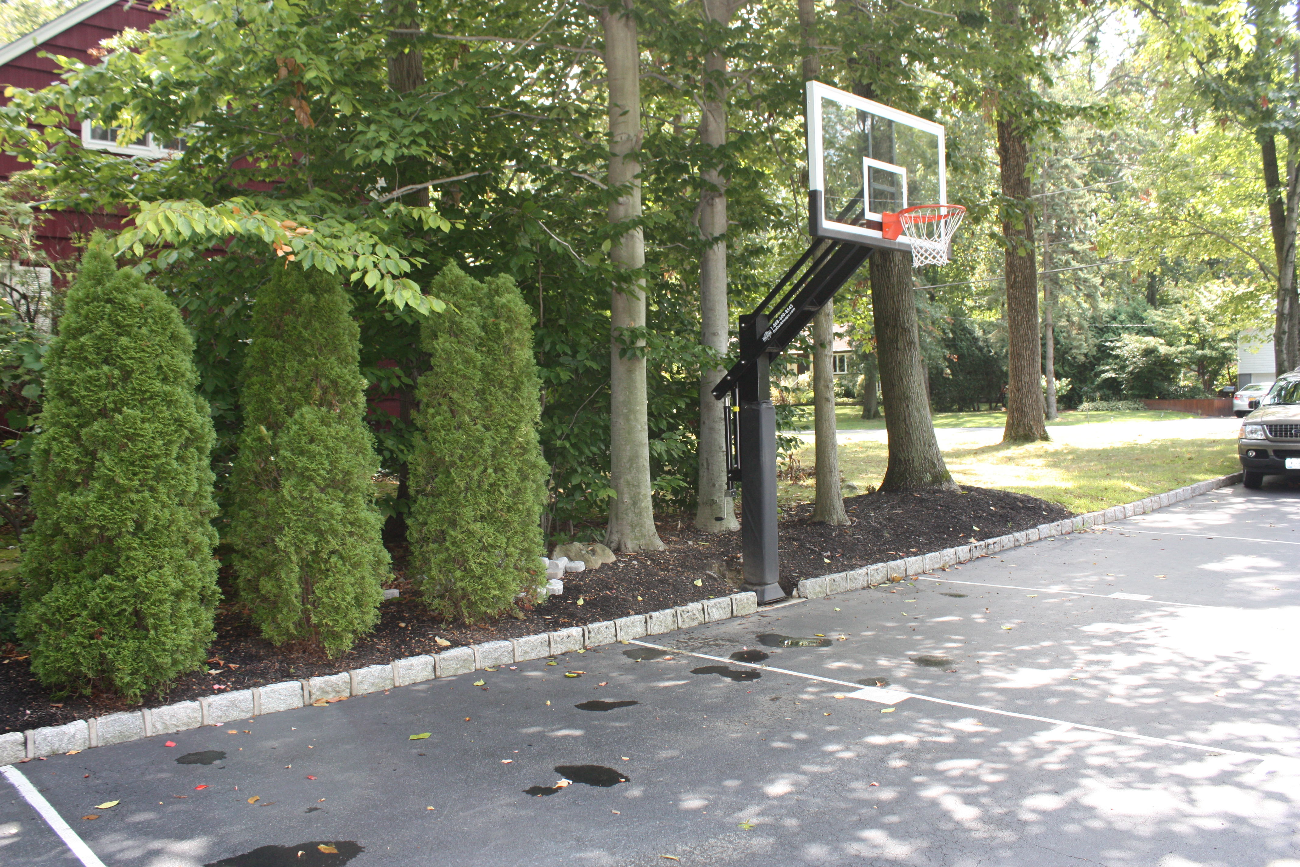 The Pro Dunk Platinum system is installed right off this asphalt court maximizing the safe play overhang of four feet.