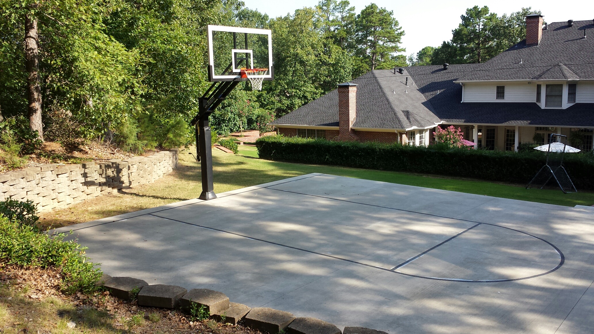 a little machinery was able to create a notch in the hill room enough for a great basketball court.