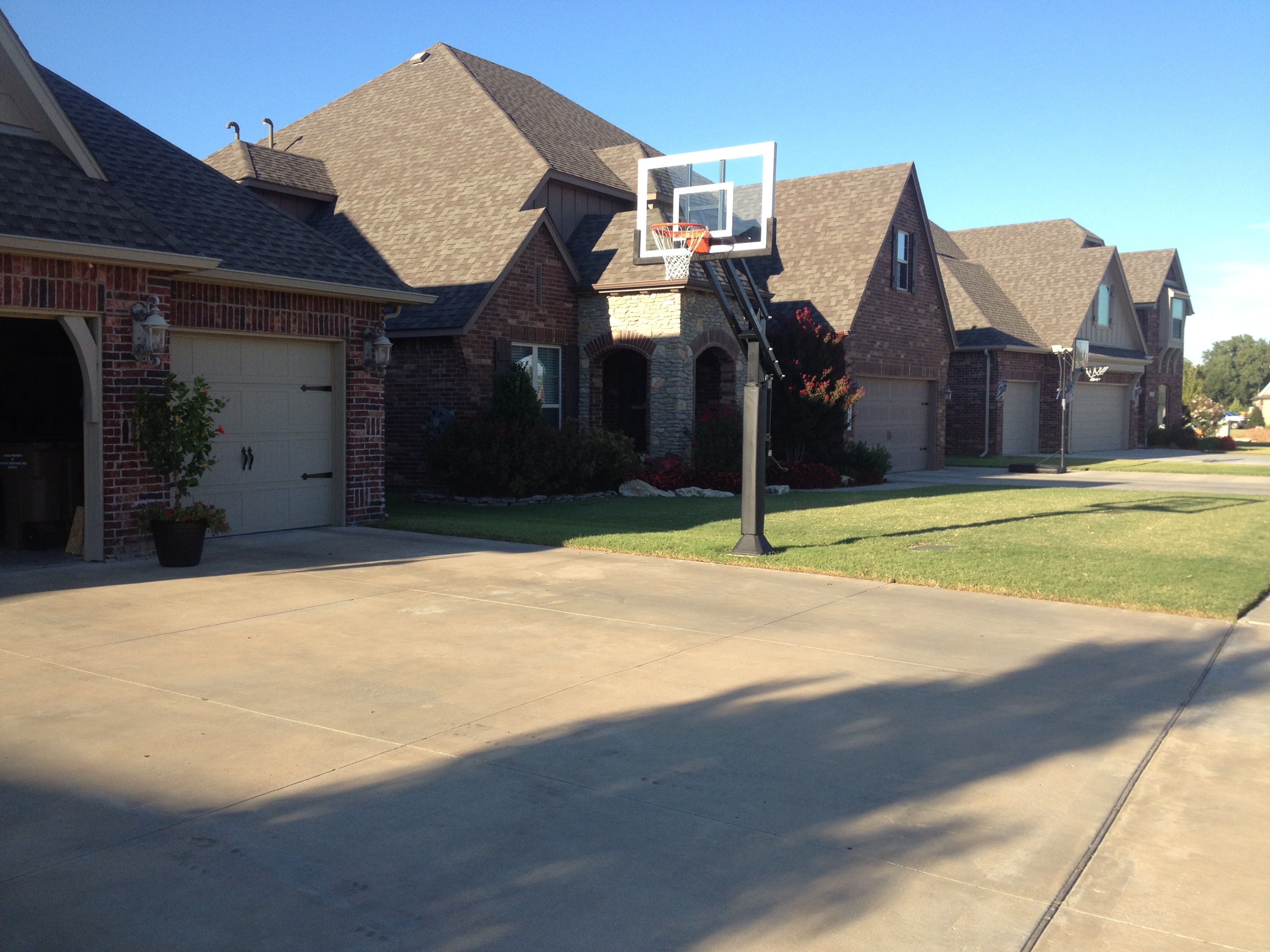 You can see her Pro Dunk Silver Basketball System that is perfectly assembled on the side of her wide concrete driveway.
