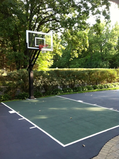 This open driveway and striped half court make the surfacing very conducive practice as well as playing.