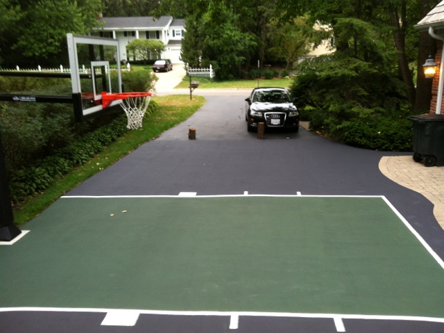 The half court playing area still plenty of room on this driveway for cars.