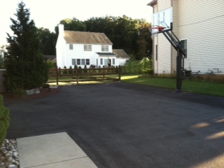 There is an angled shot of a Pro Dunk Gold Basketball System and you can see he expanded his driveway on the right side of the original sized driveway.