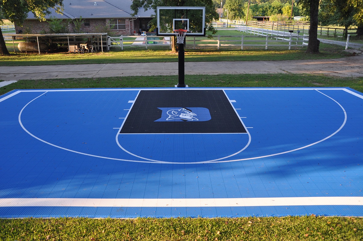 In the background you can see Pro Dunk Diamond Basketball System behind the Duke Blue Devils-themed half court. 