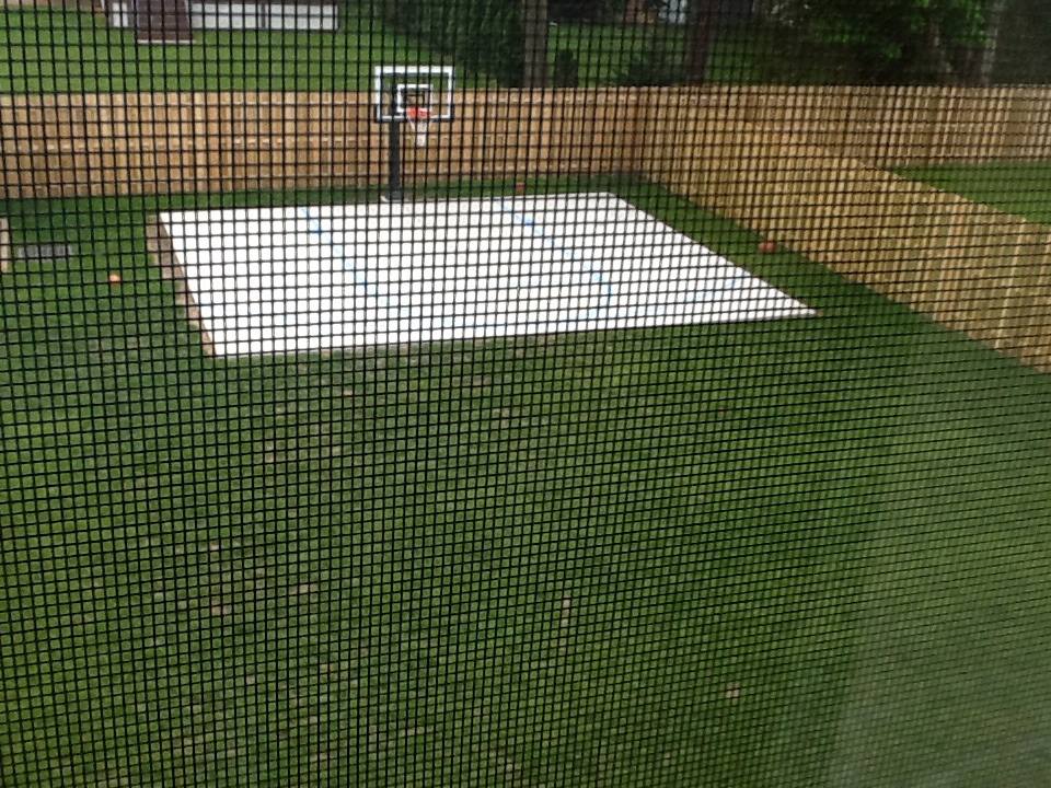 Aerial view of a backyard court from the second story of the house.