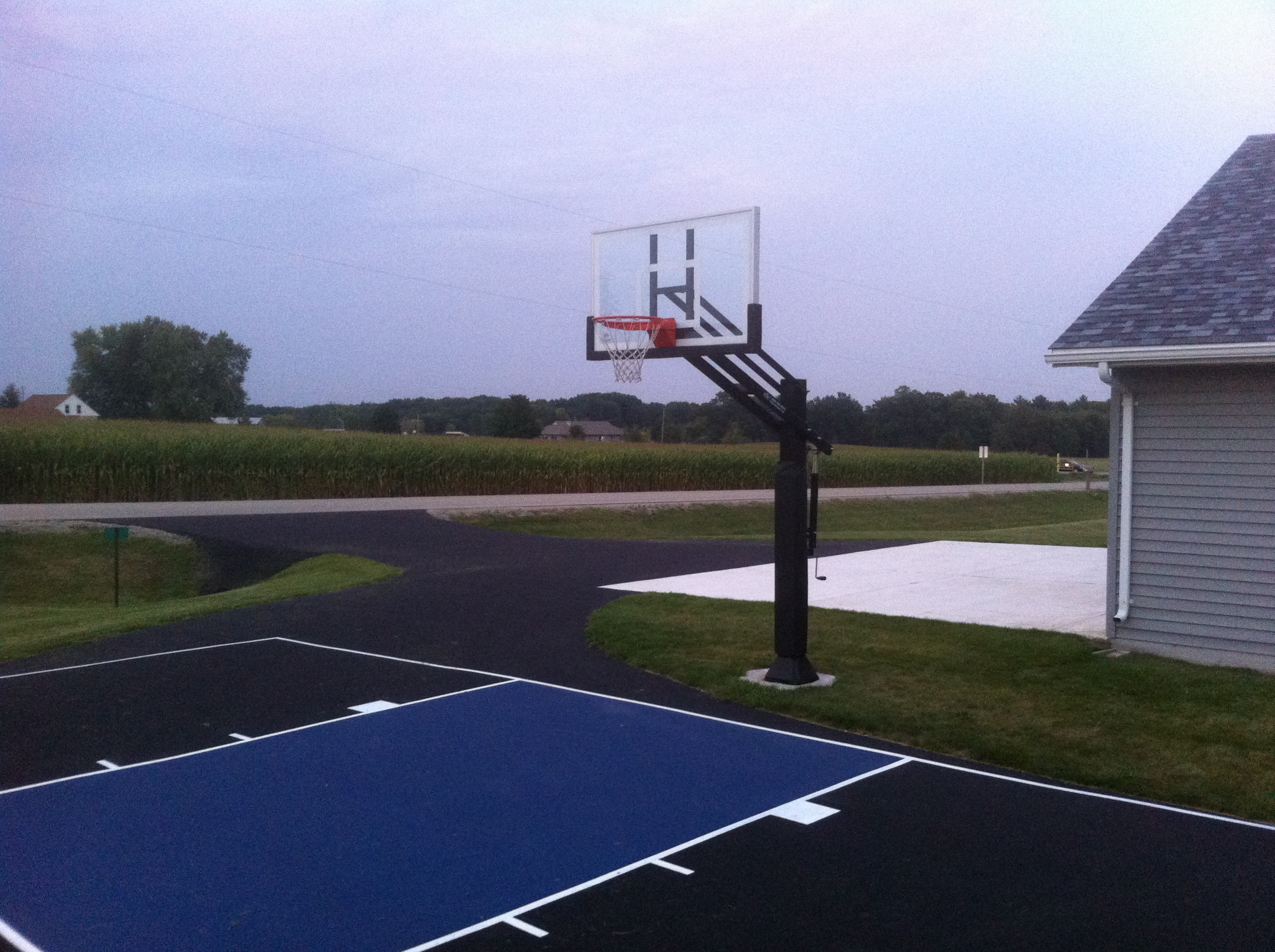 This Pro Dunk adjustable in ground front yard basketball system does wonders for the front yard.