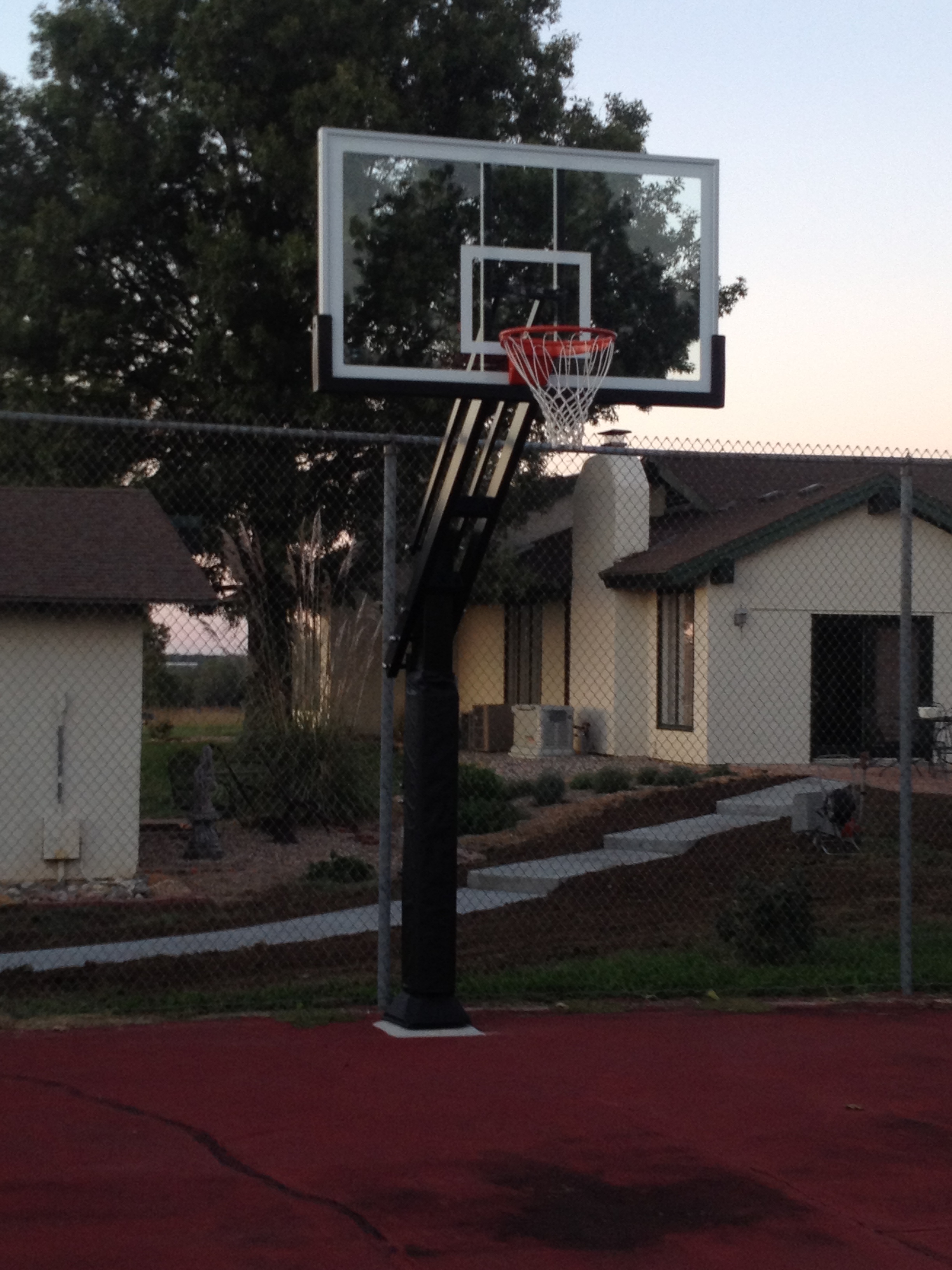 This front shot shows the Pro Dunk Platinum Basketball system installed at the end of this old tennis court. 