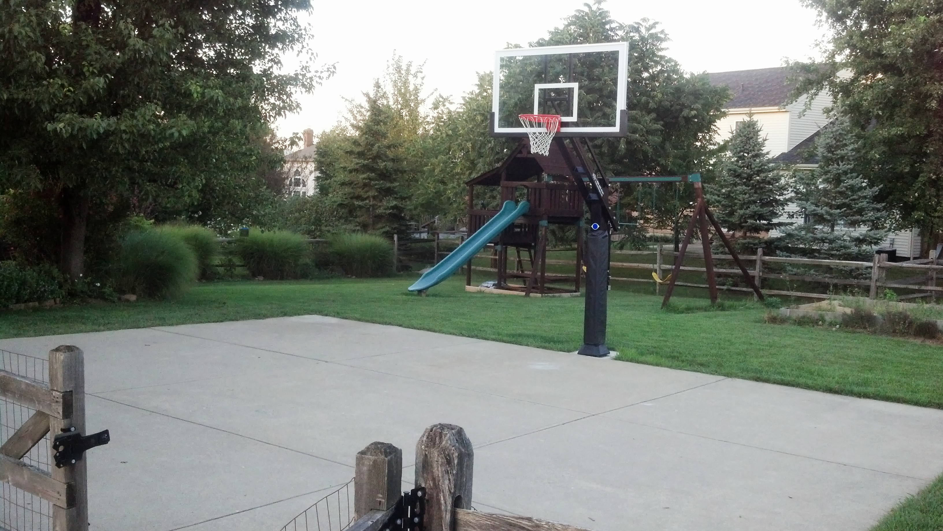 Another view of Pro Dunk Platinum Basketball System in the front yard. 