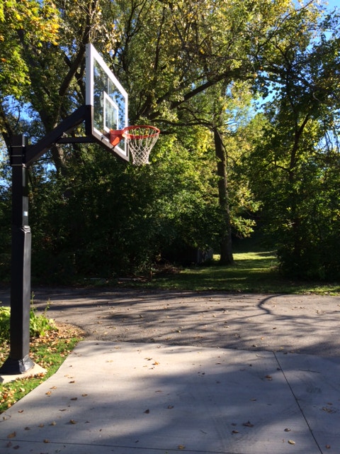 It is a beautiful day to grab a basketball and shoot some baskets.