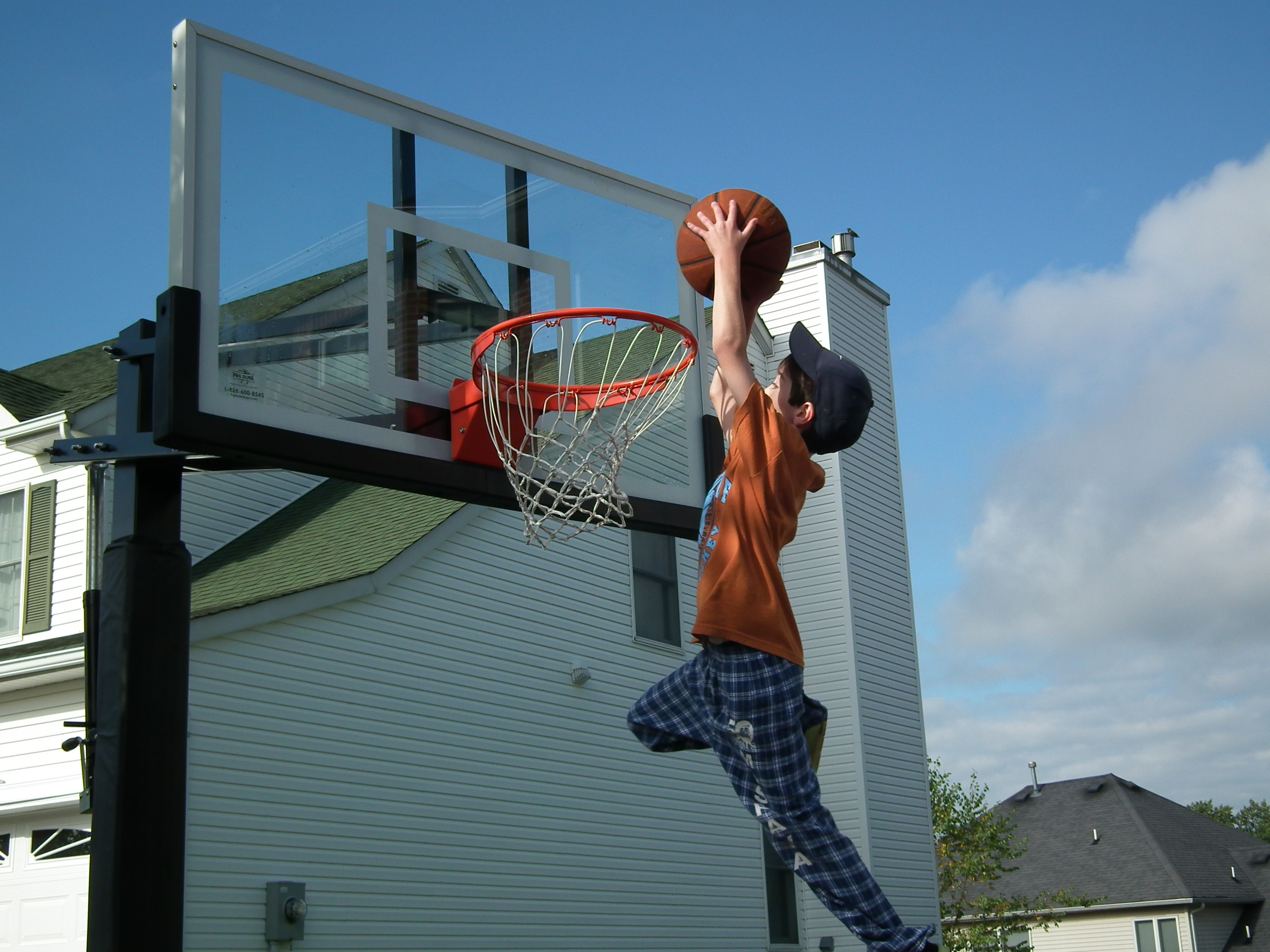 This boy likes to dunk the basket a lot.