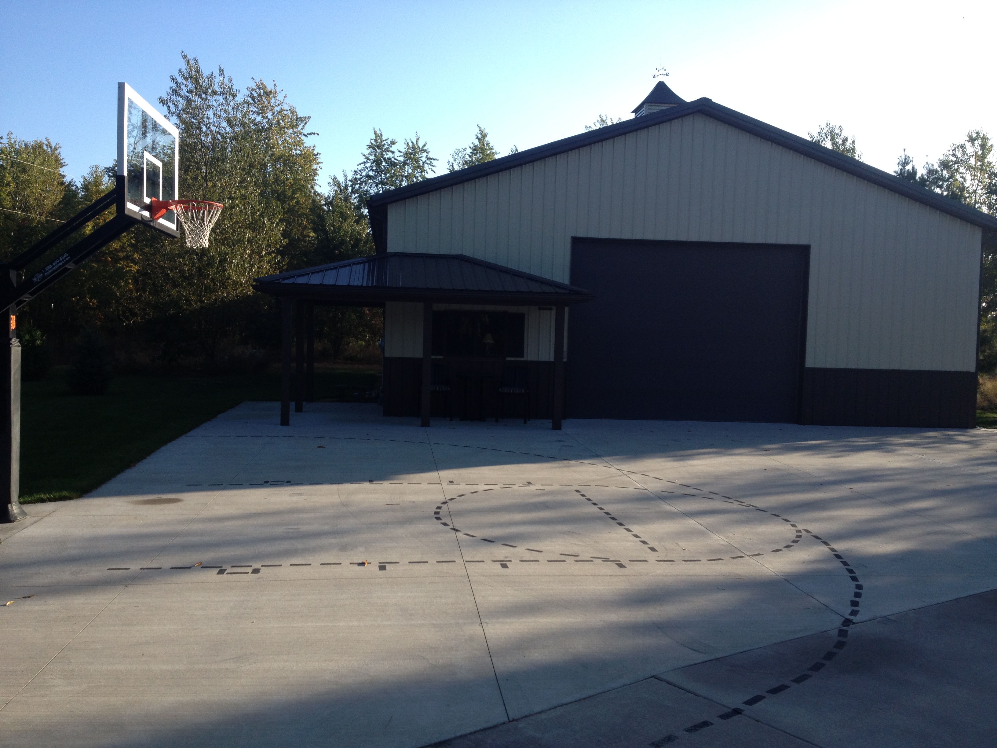 This side view shows the Pro Dunk Platinum Basketball system in front of this Michigan home's garage. 
