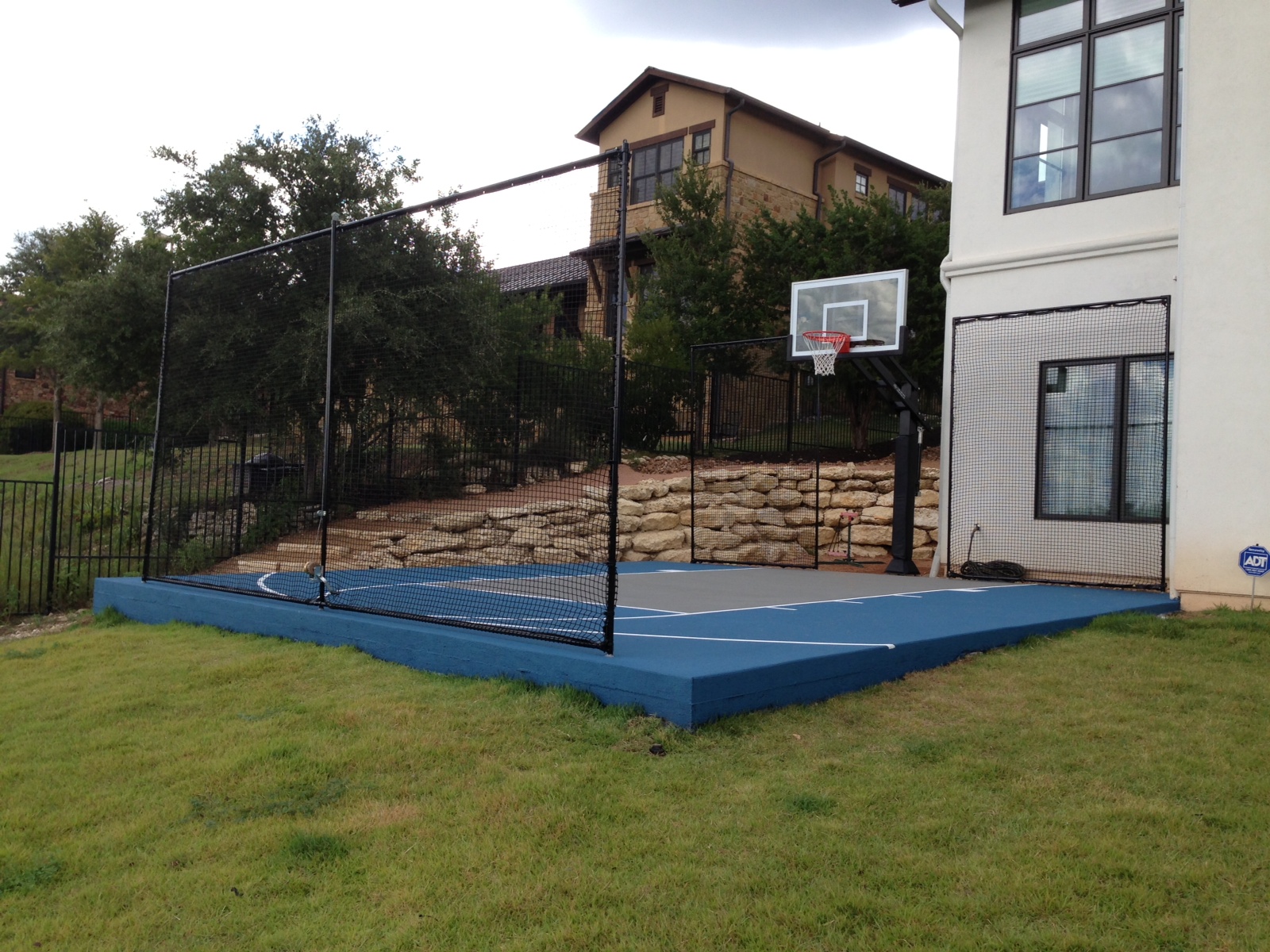 This Pro Dunk Gold Basketball system sits over a painted half court.